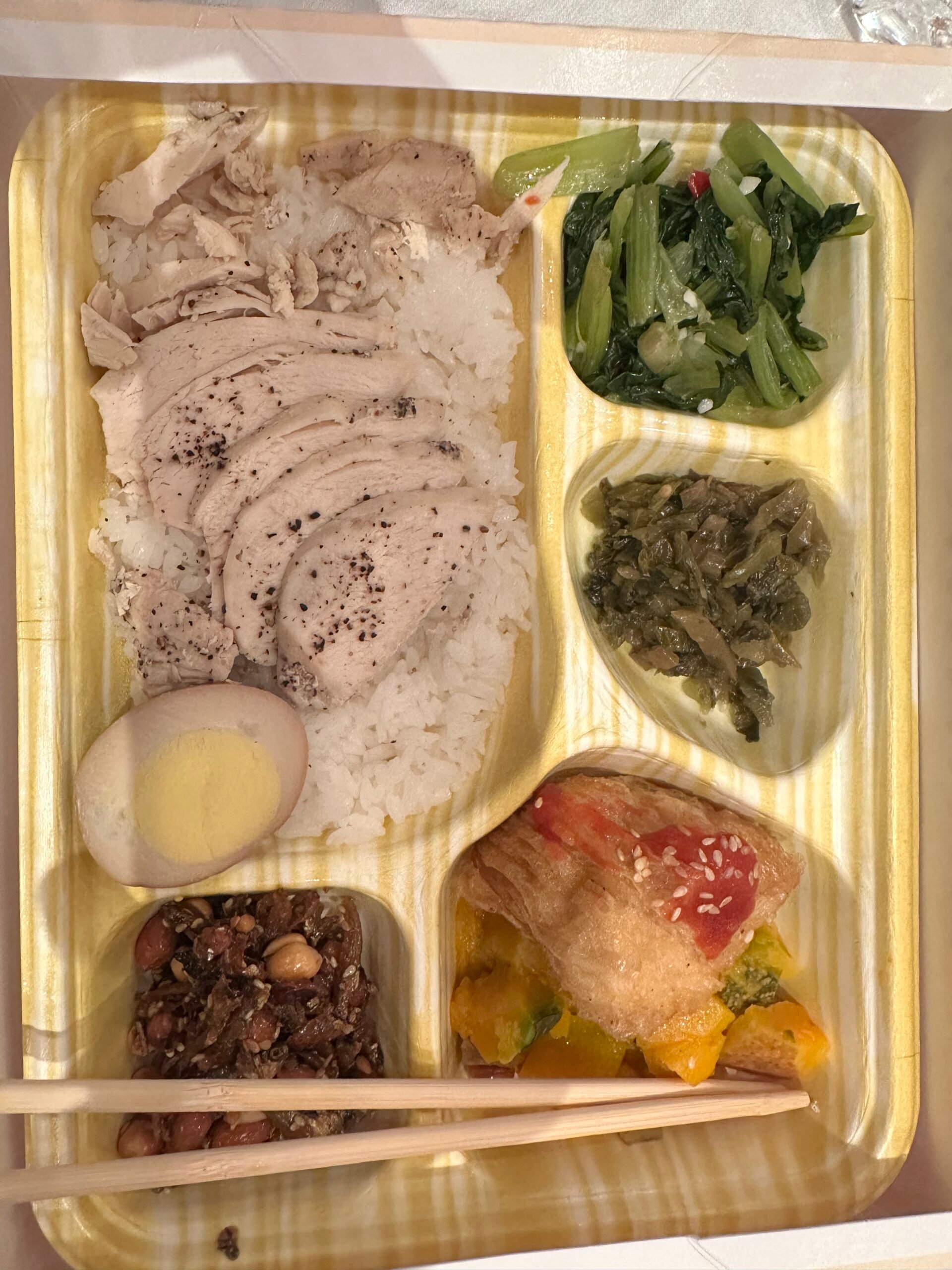 Divided lunchbox with protein and vegetables