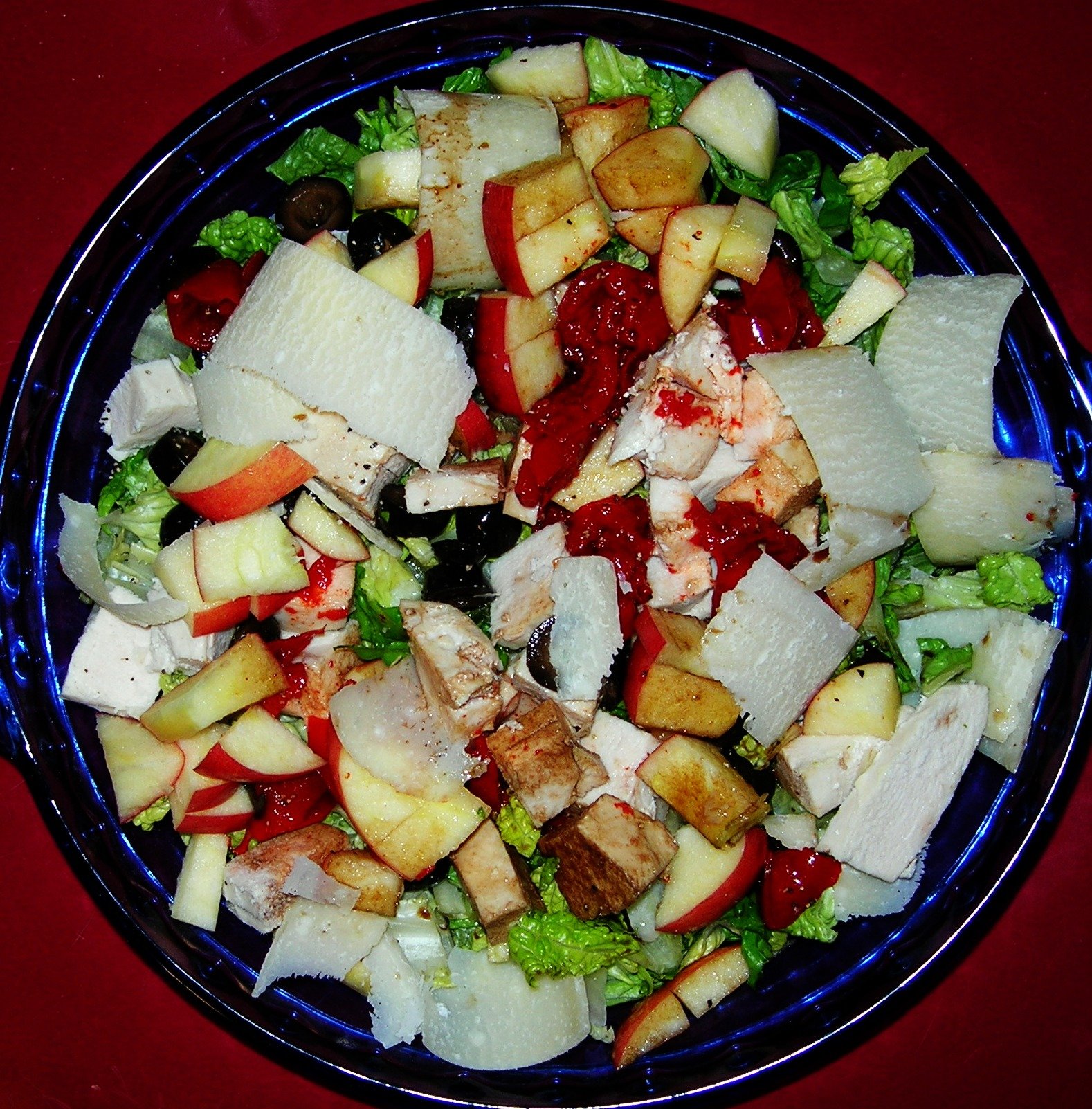Chicken salad with apple, pimento, greens, and shaved cheese