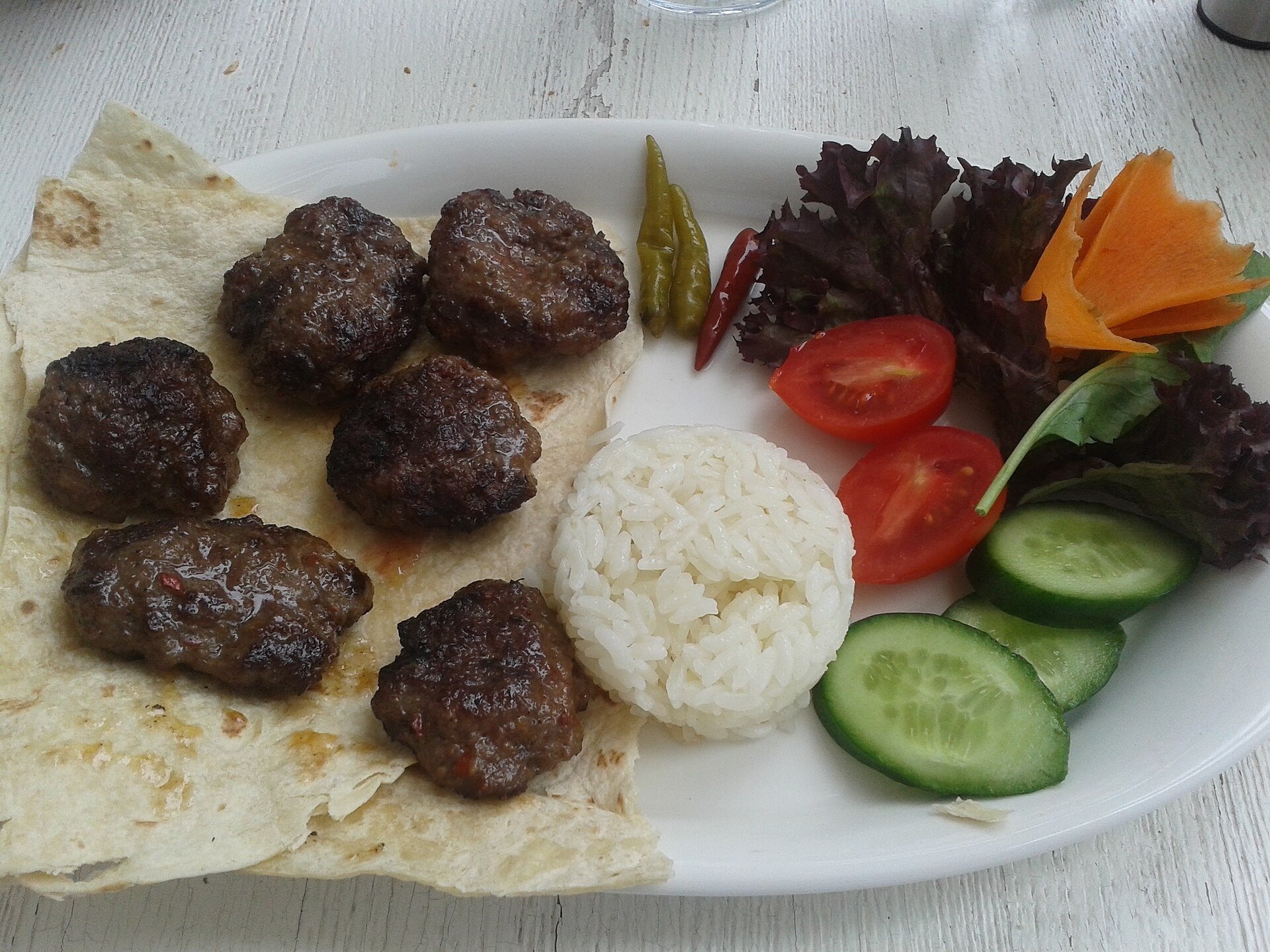 Cooked turkey-style meatballs with rice and vegetables for meal prep