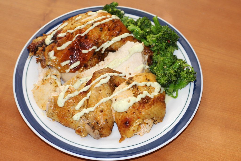 Peruvian garlic lime chicken breast served with rice and greens