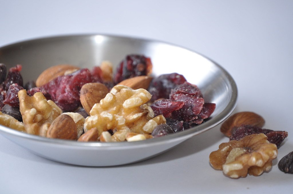 Trail mix snack bowl with nuts and dried fruit