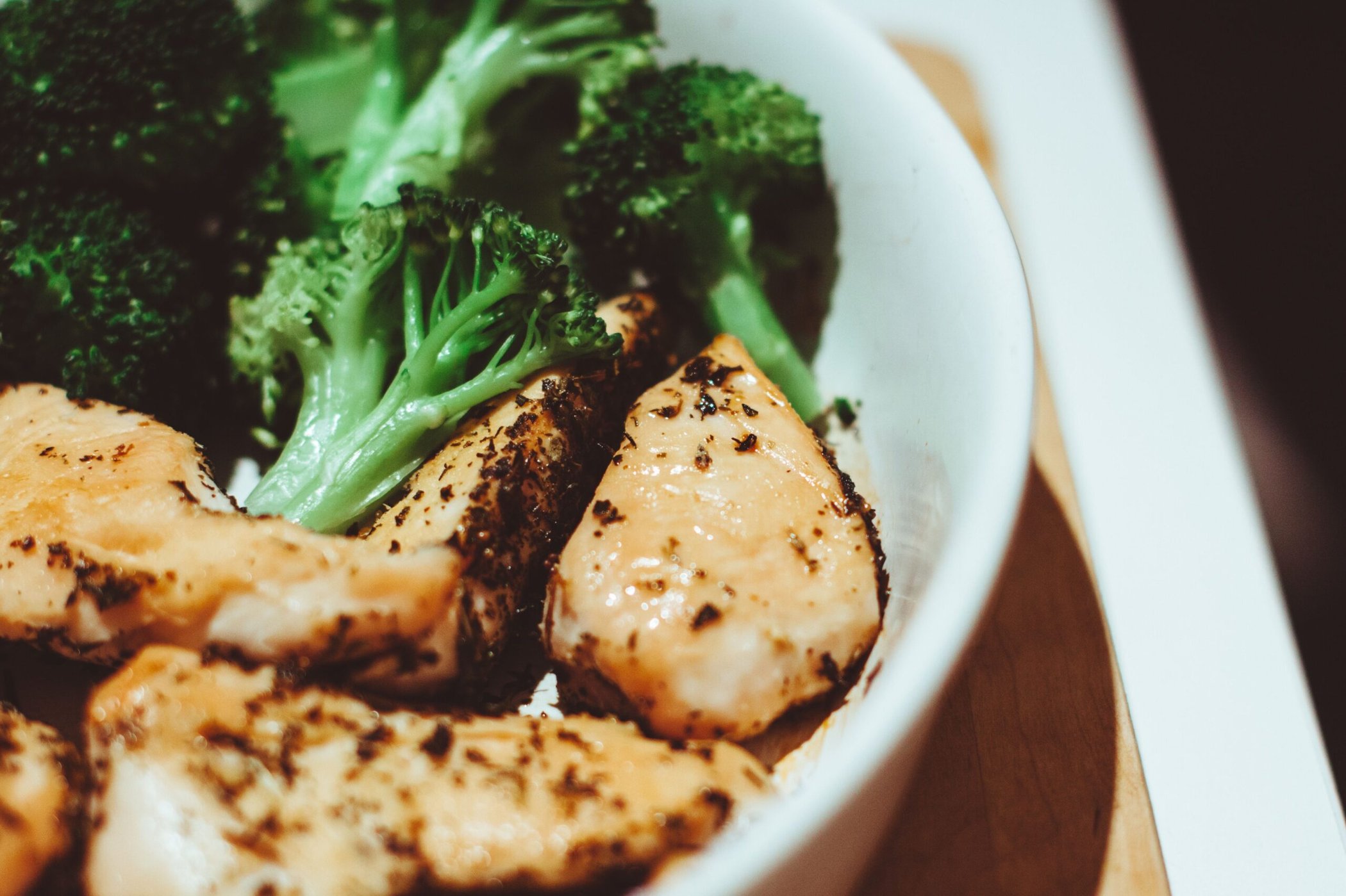 Cooked chicken with broccoli in a bowl