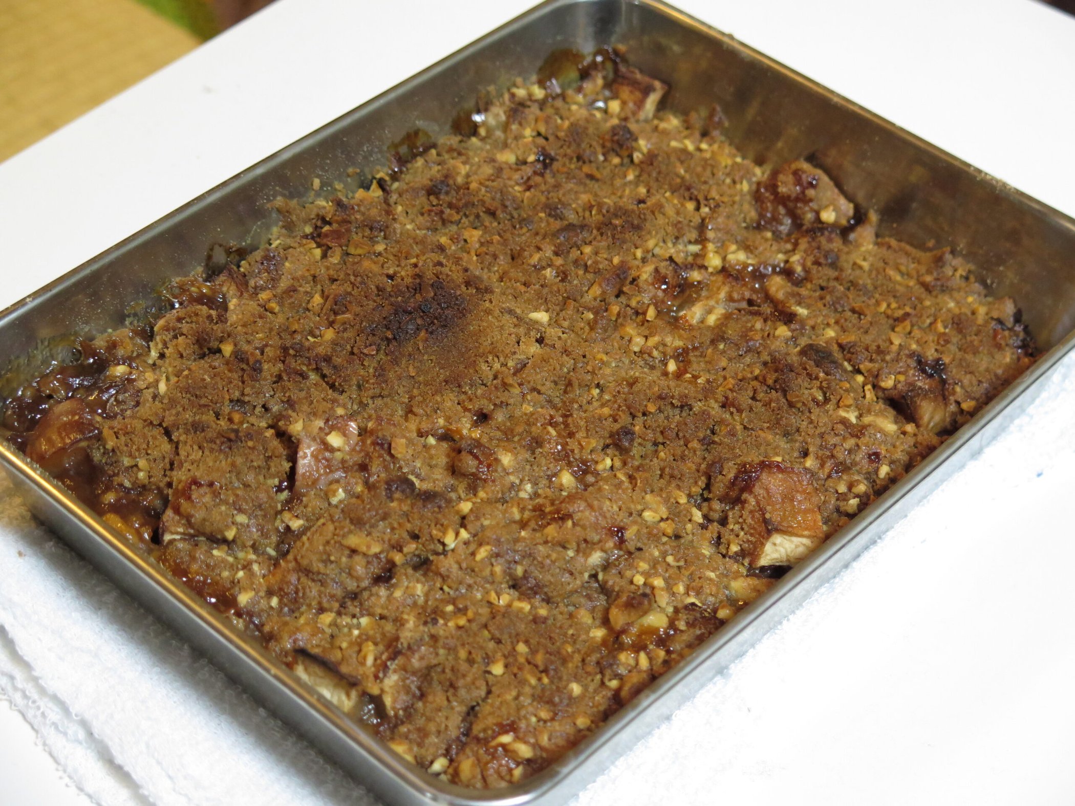 Baked apple crisp with golden crumble topping in a baking dish