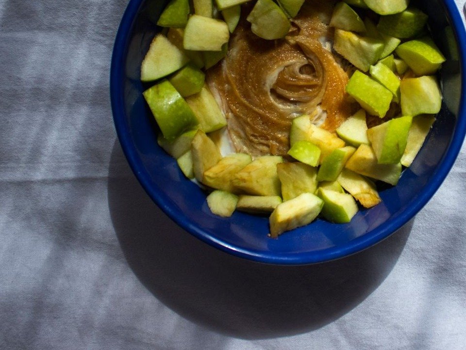 Apple pieces with creamy peanut butter Greek yogurt dip