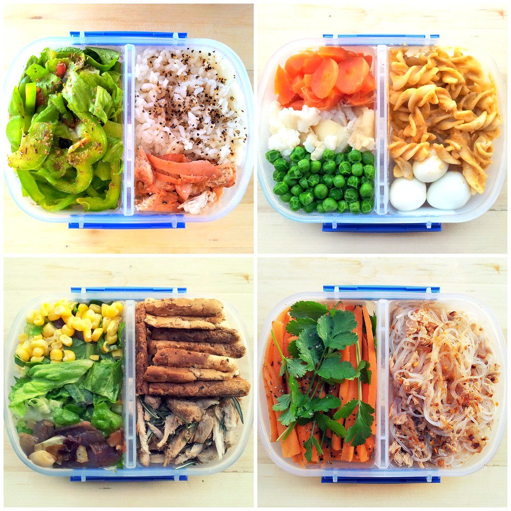 Kids lunchbox bento-style meal with vegetables, rice, eggs, noodles, and protein-rich snack portions